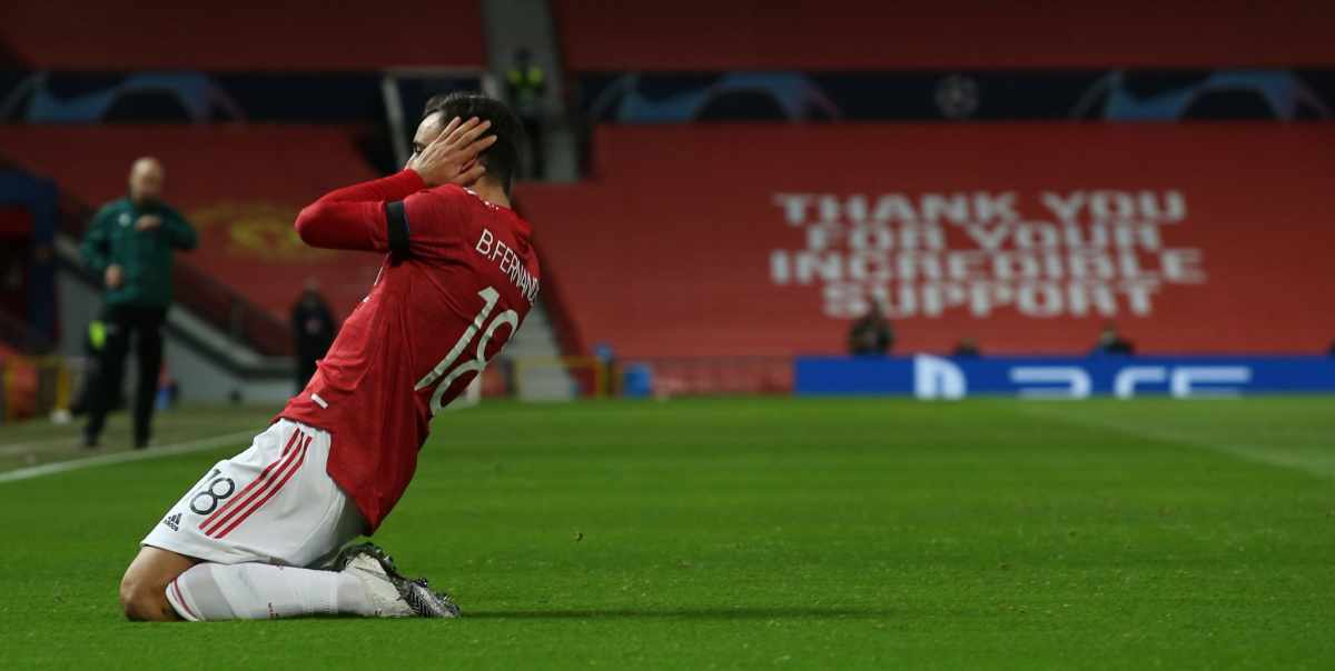 Grassroots football coach reviewing tactical notes during an intense match moment, players in the background showing determination and focus, representing the psychological patterns and behavioural momentum that separate teams who genuinely improve from those experiencing random form fluctuations in UK grassroots football