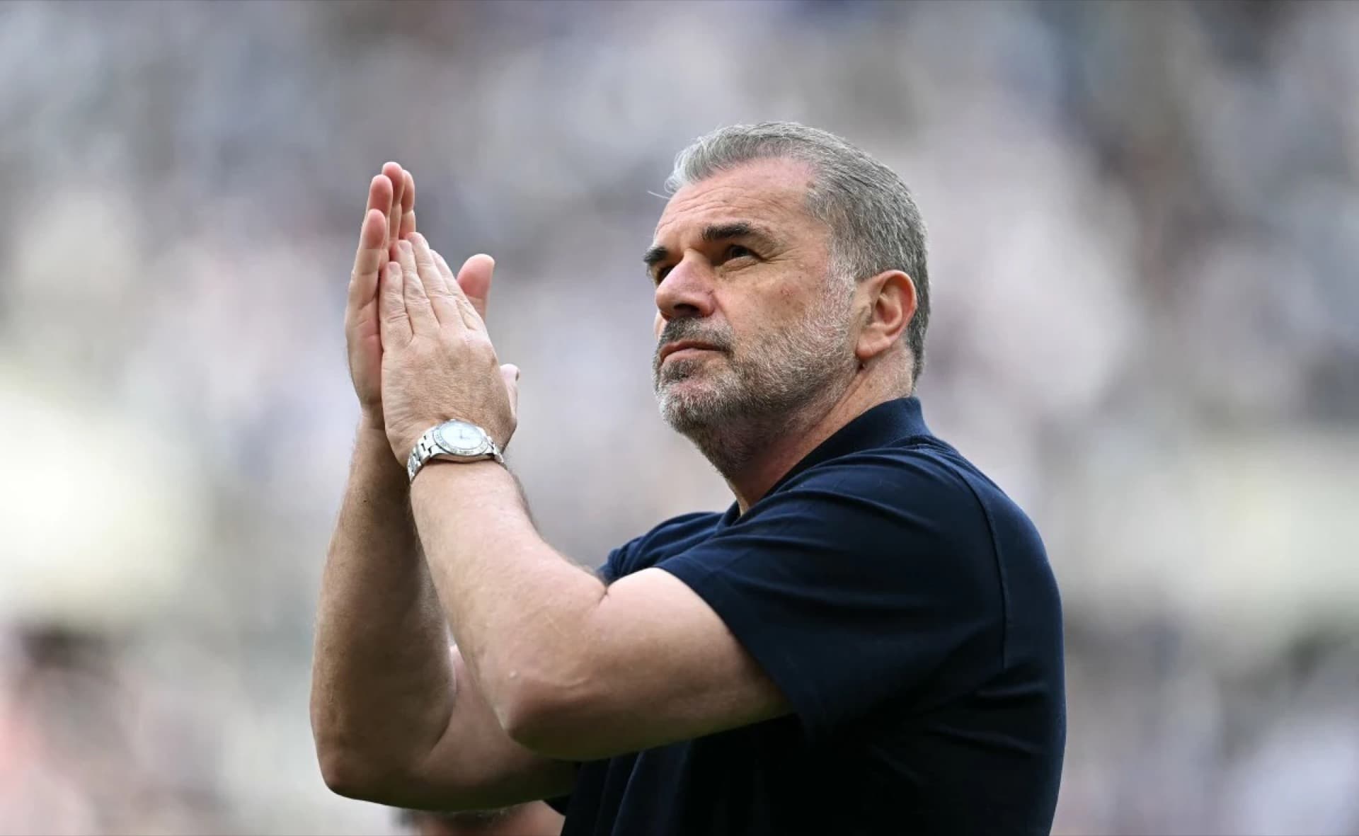 Ange Postecoglou applauding fans during his brief 39-day tenure at Nottingham Forest, symbolising the tension between patience and impatience in modern football management